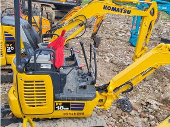 Minikotró Komatsu PC18MR: 5 kép.