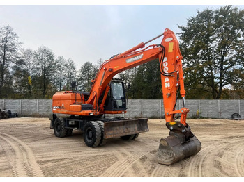 Gumikerekes kotró DOOSAN DX140W-3